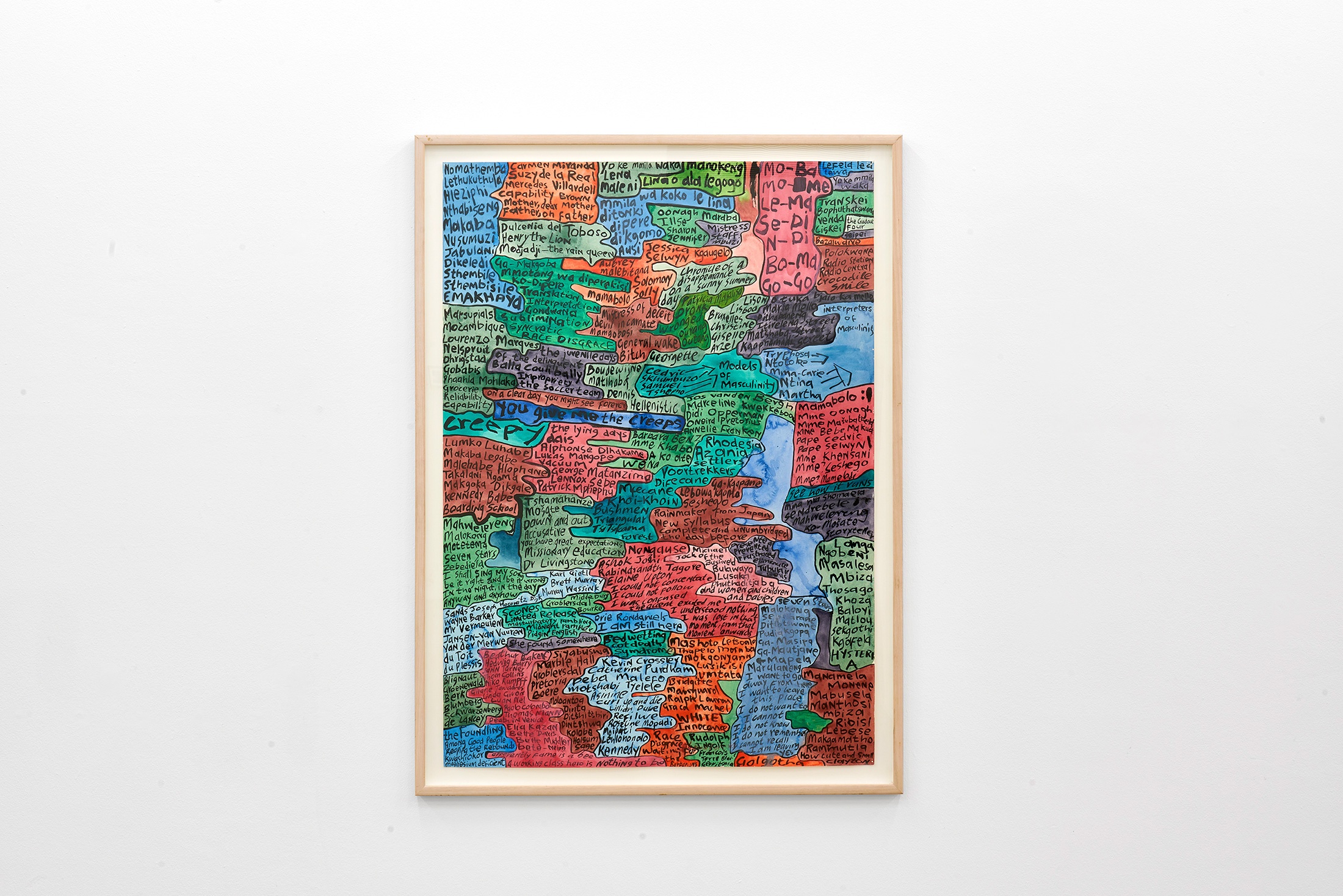 Installation photograph that shows Moshekwa Langa’s framed mixed-media work ‘Index Drawing (you give me the creeps)’ mounted on a white wall.
