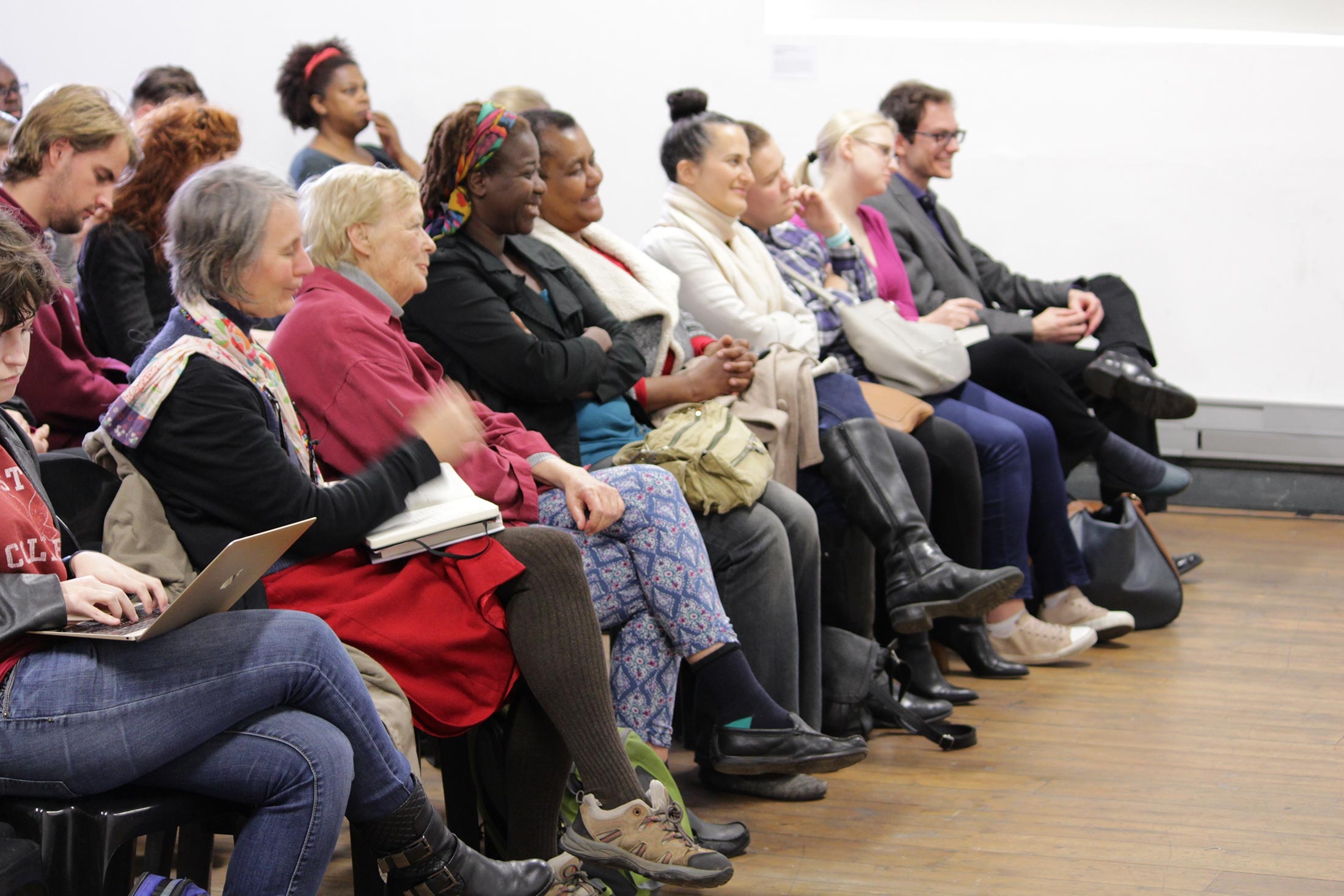 Event photograph from the 2019 rendition of the Open Book Festival on A4’s ground floor that shows rows of seated attendees.
