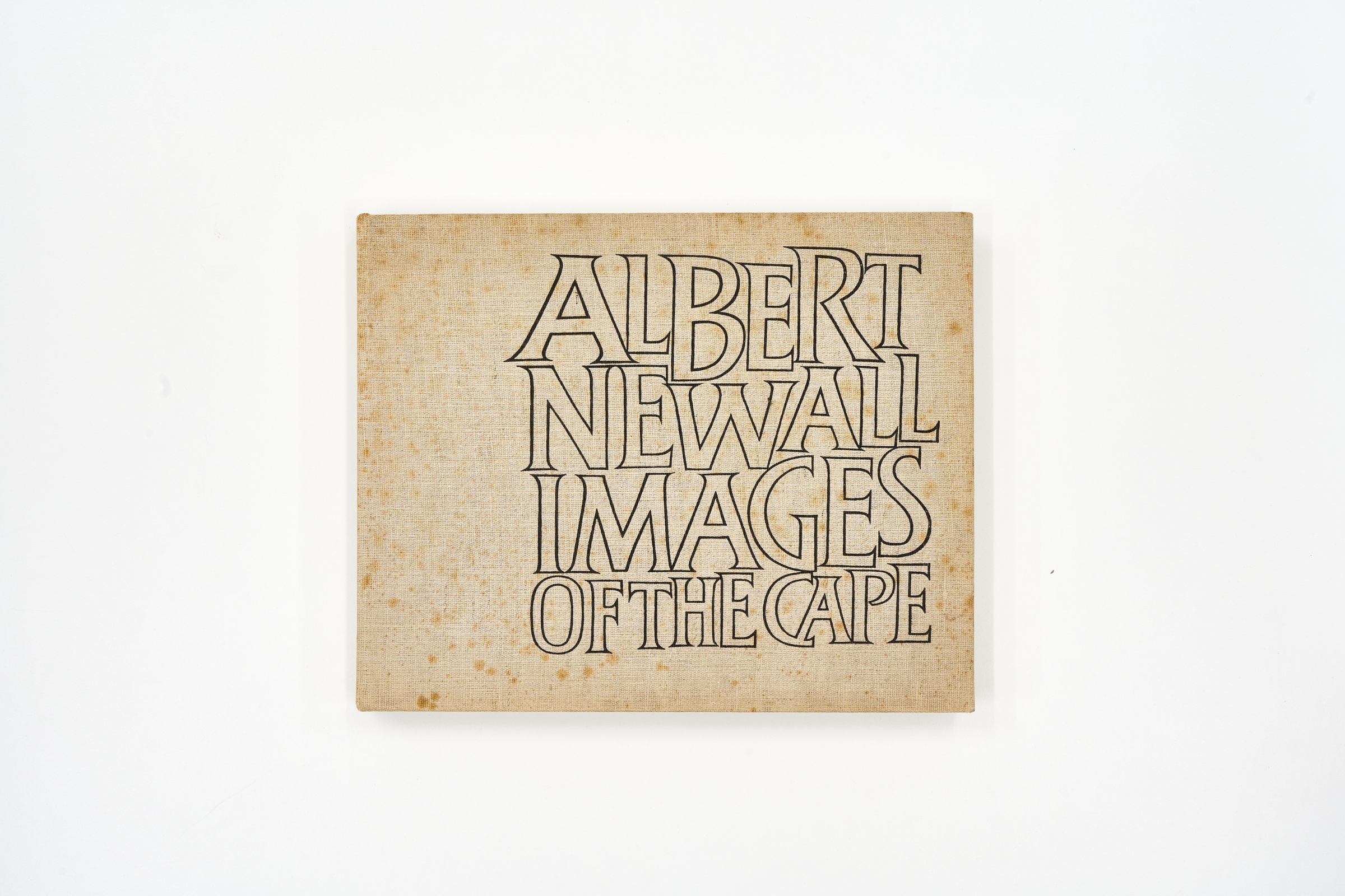 A topdown photograph of the cover of Albert Newall's photo-book 'Images of the Cape' on a white background.

