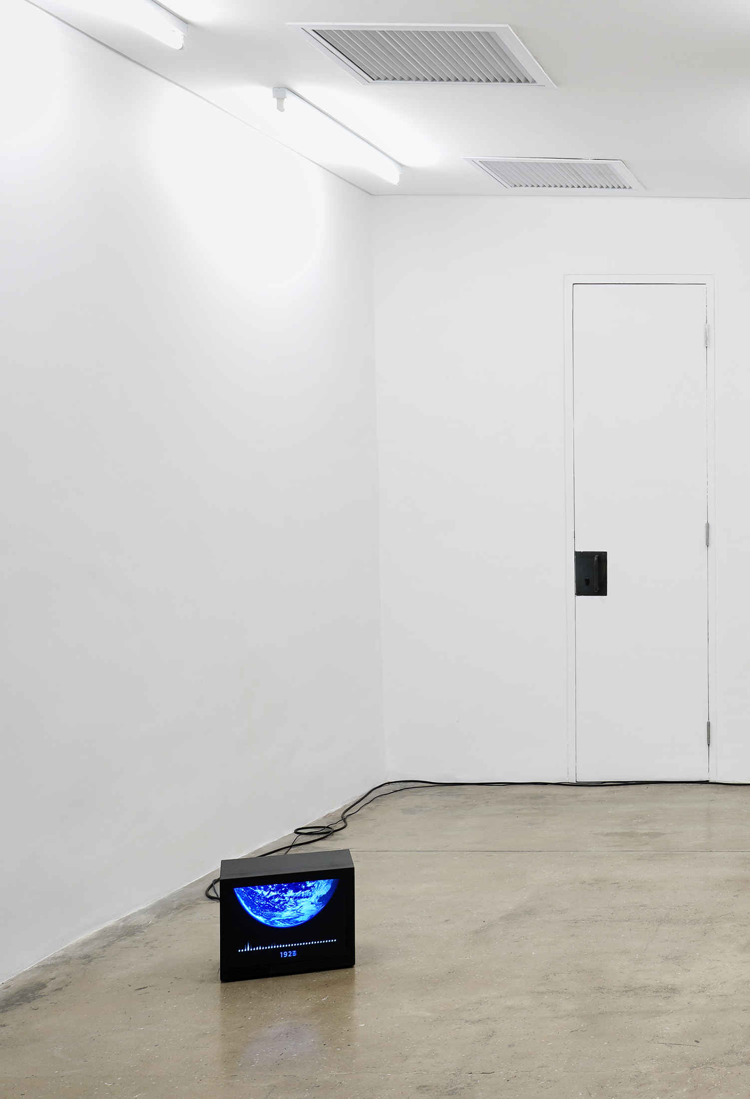 Installation photograph from the ‘Sounding the Void, Imaging the Orchestra V.1’ exhibition in A4’s Gallery. Chris Chafe's video and sound work 'The 1200-year Climate Podcast (an excerpt)' is playing on a screen sitting on the concrete gallery floor.
