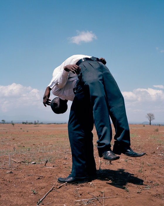 Viviane Sassen's photographic print 'Two Friends' depicts one child balancing another on their back.
