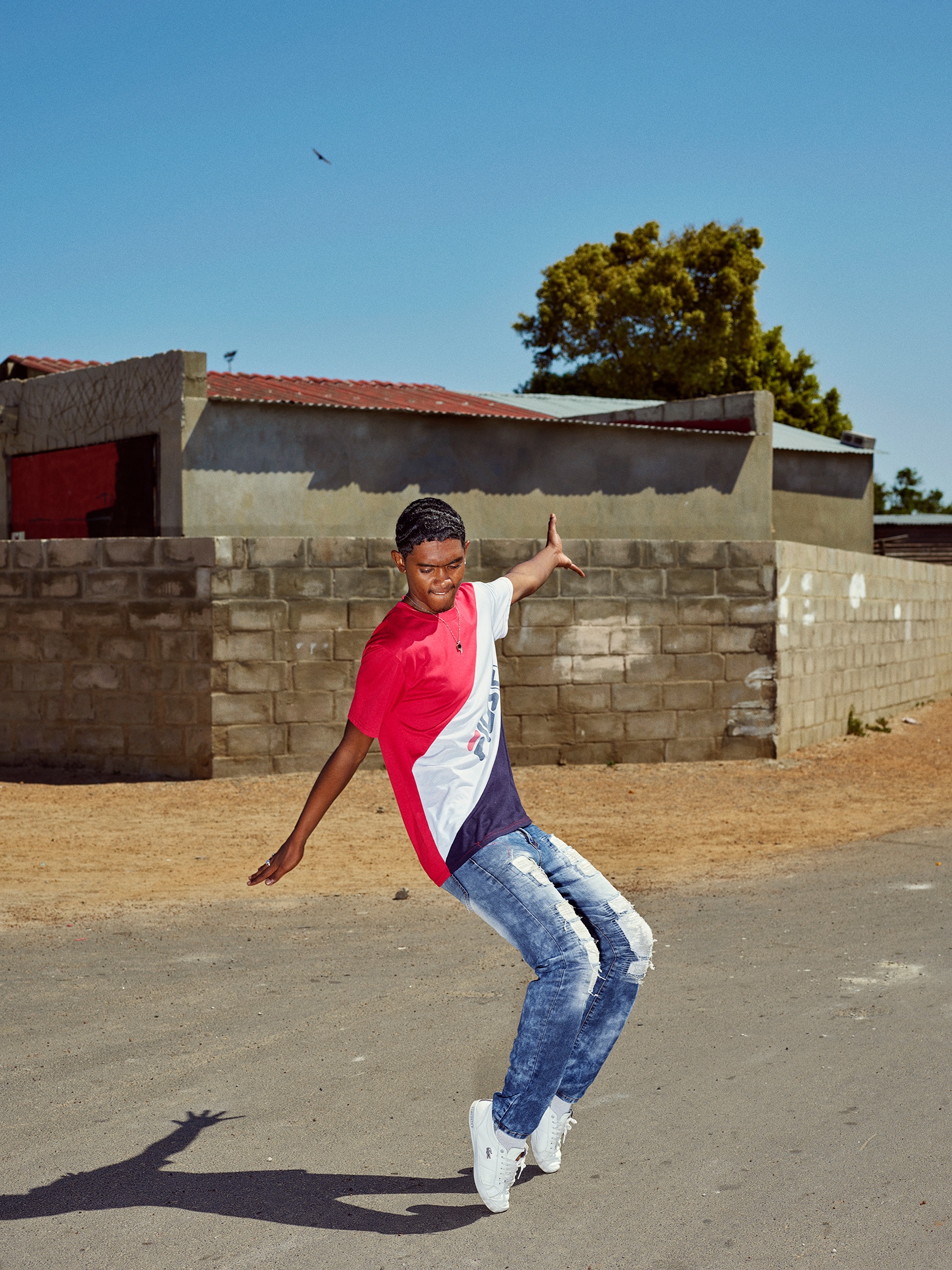 Photograph by Pieter Hugo, from A4’s ‘Atlantis Project’ exchange with the SWAGG United Dance Crew, that depicts a young person dancing in the street.
