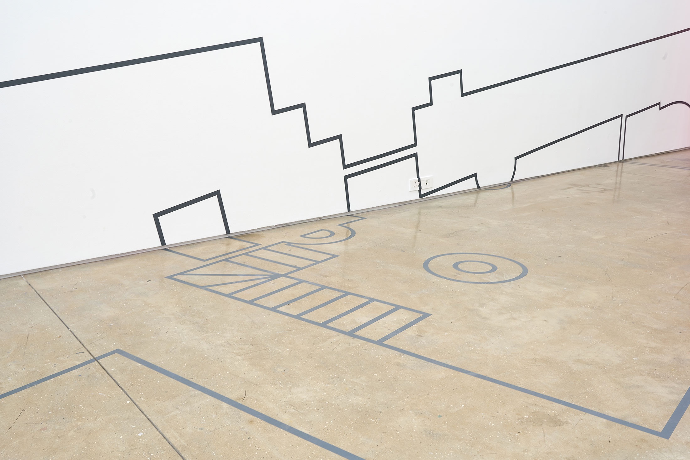 Installation photograph from the ‘Customs’ exhibition in A4’s Gallery. Dor Guez’s vinyl work ‘Double Stitch’ features vinyl line drawings that stretch across the gallery floor and wall.
