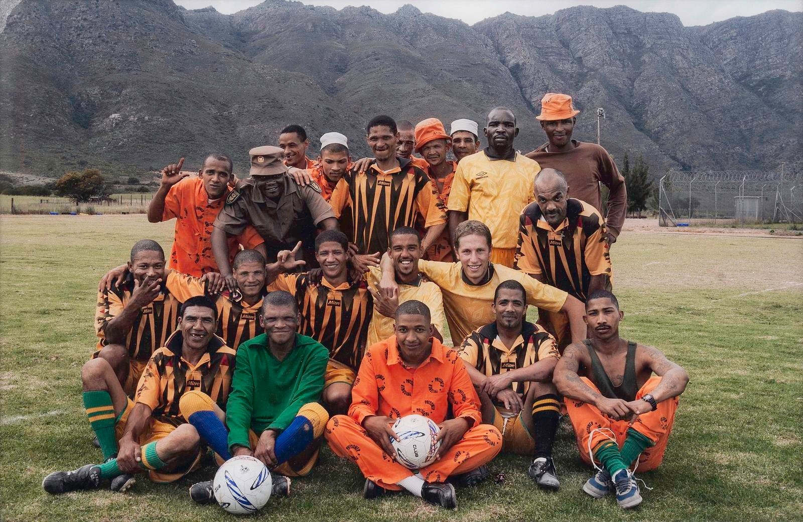 Mikhael Subotzky's photograph 'Self-Portrait with Soccer Team, Voorberg Prison, 2004'.
