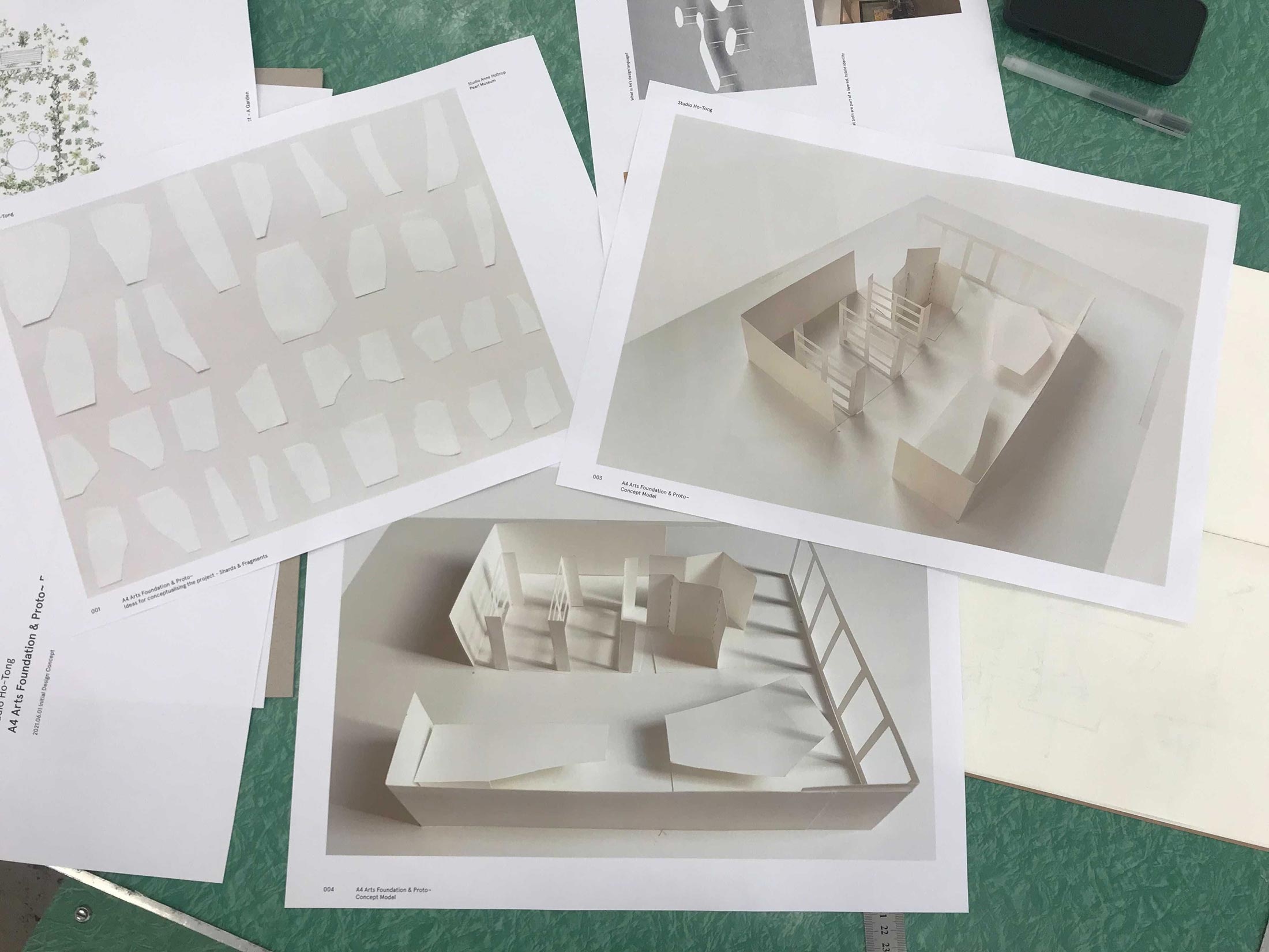 Process photograph from ‘Landscaping the Store,’ Meghan Ho-Tong’s redesign of A4’s Proto~ museum store. A table with cutting mat holds printouts from the design process.
