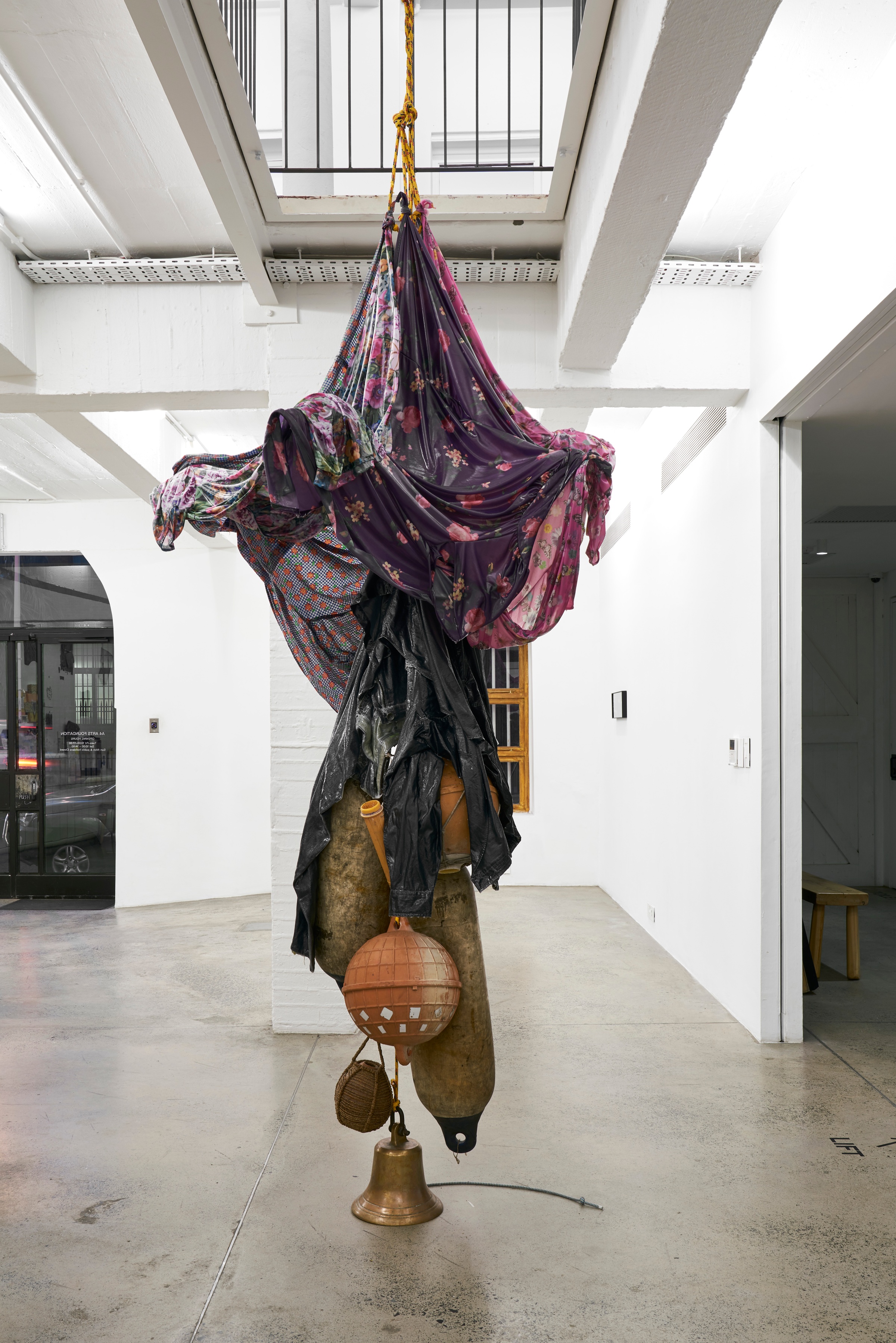 A photograph of Kevin Beasley's untitled sculpture suspended from the ceiling.
