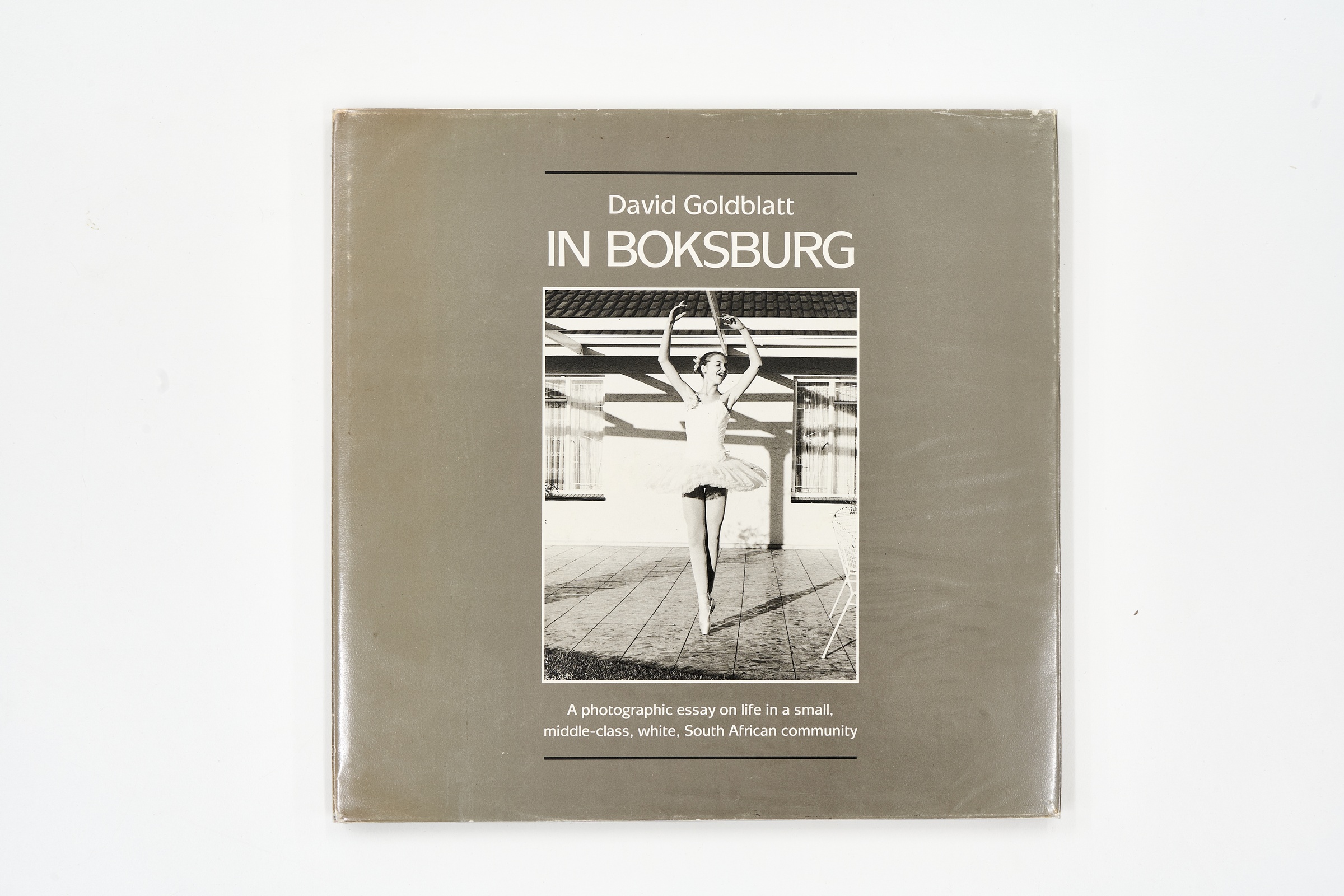A topdown photograph of the cover David Goldblatt's photo-book 'In Boksburg' on a white background.
