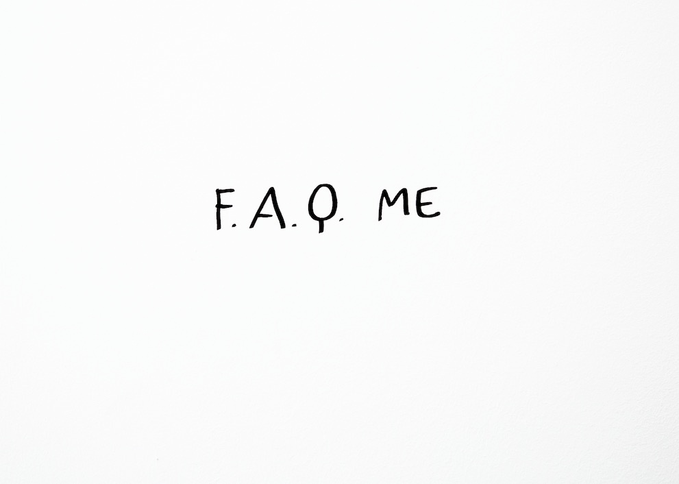 Image from the ‘FAQ’ event in A4’s Gallery on First Thursdays’ Museum Night that consists of white background with black handwritten text that reads ‘F.A.Q. ME’.
