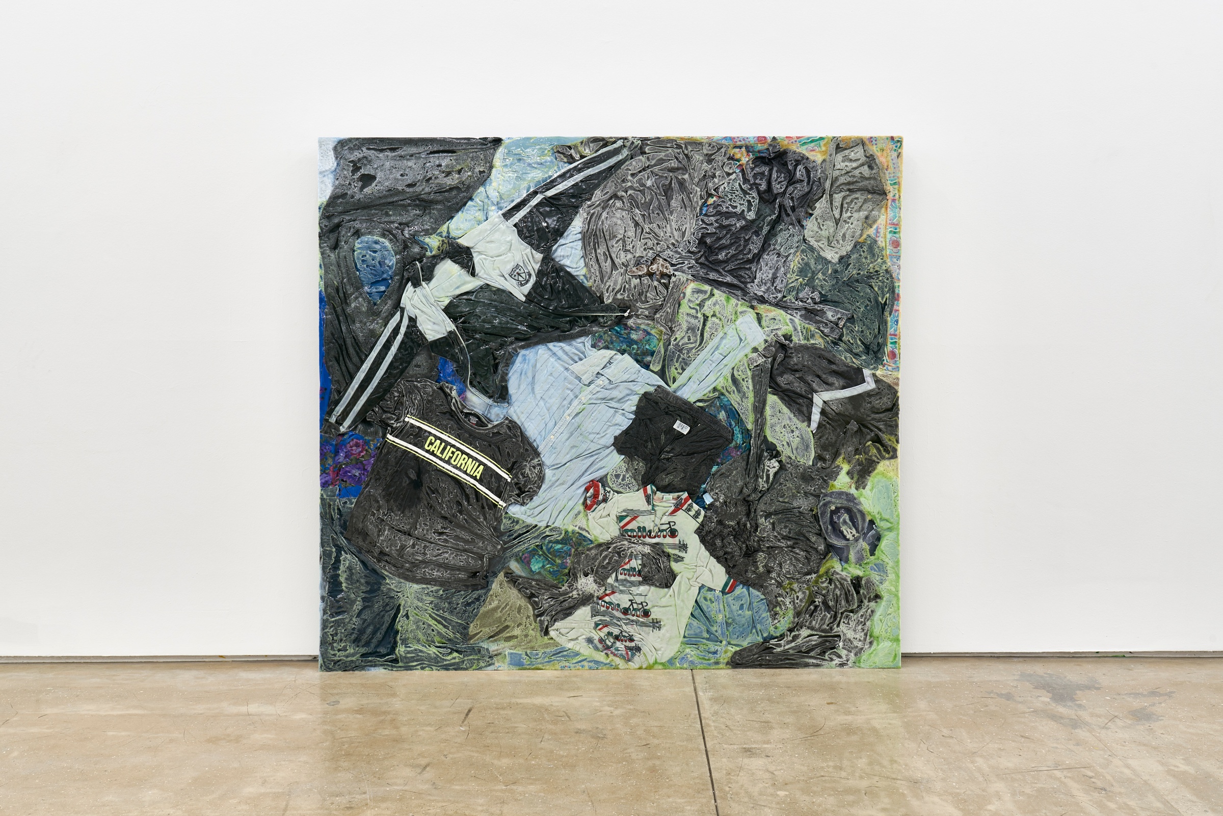 A photograph of Kevin Beasley's mixed media work 'California South Africa' leaning against a white wall.
