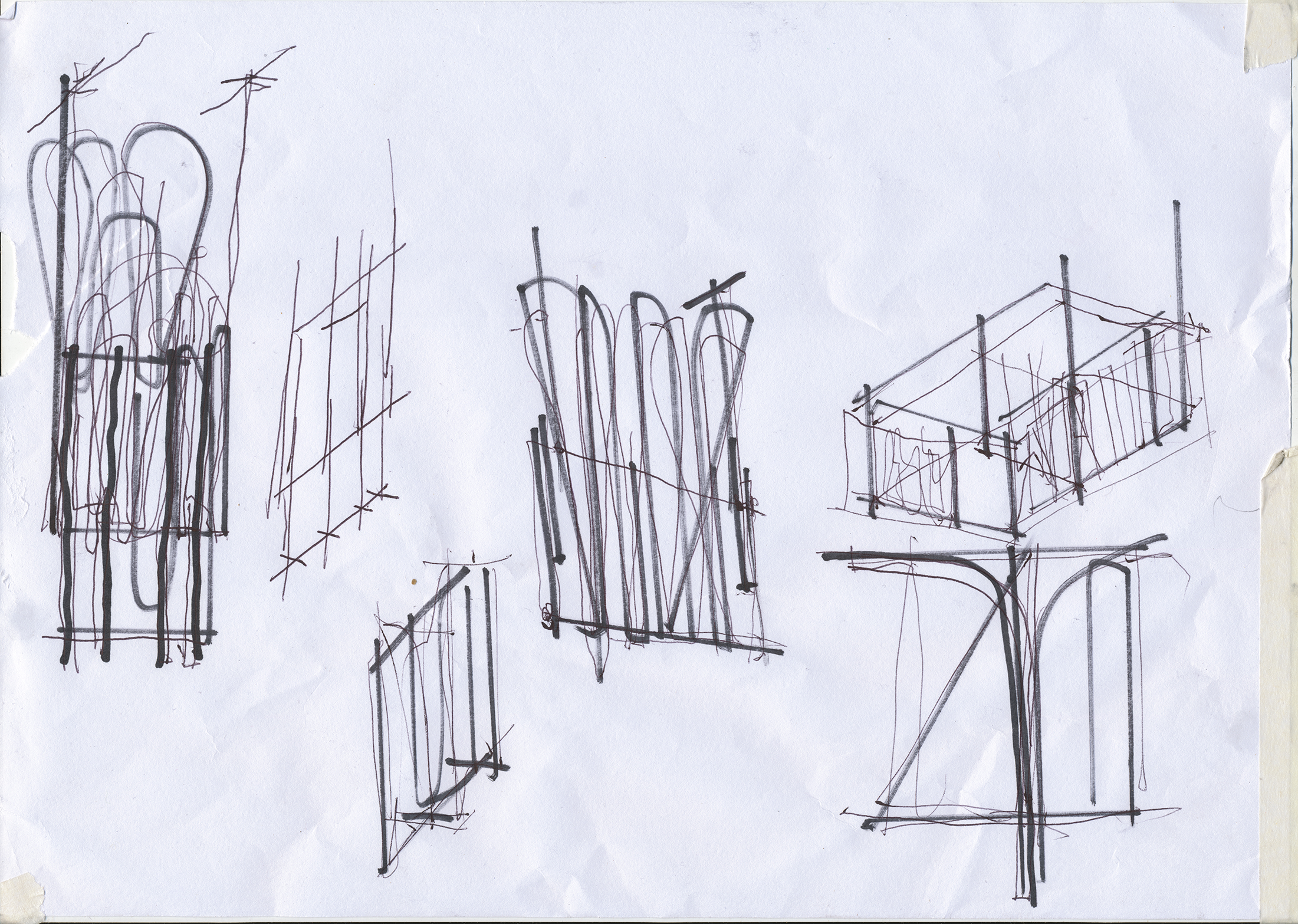 Process photograph from Unathi Mkonto’s residency on A4’s top floor. Multiple overlapping charcoal and pen drawings on a sheet of paper depict potential artworks and exhibition layouts.
