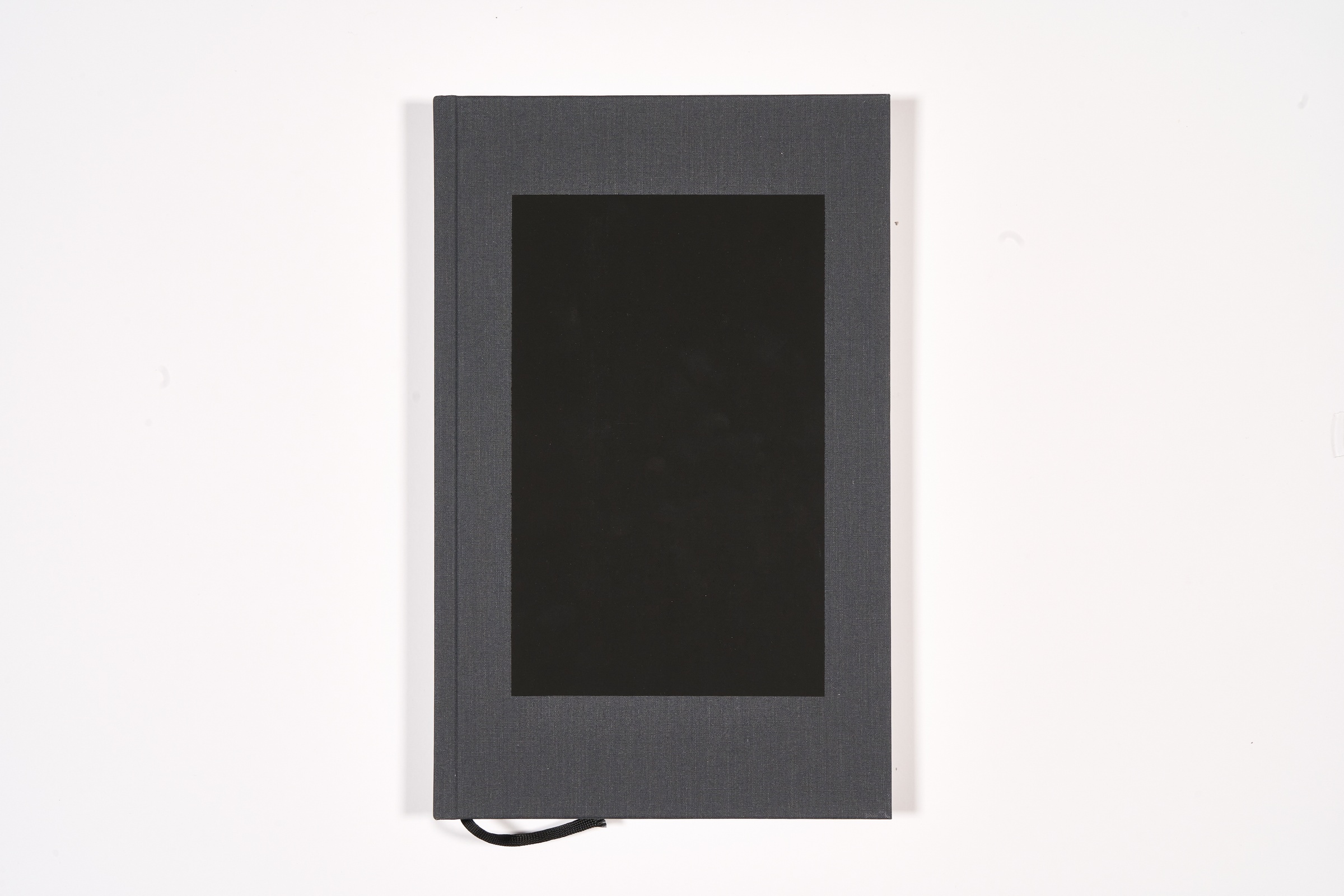A topdown photograph of the cover of Mikhael Subotzky and Patrick Waterhouse's photo-book 'Ponte City' on a white background.

